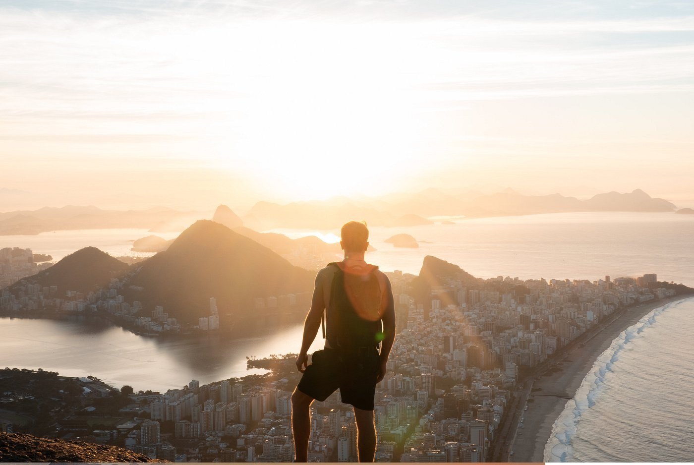 Visitor looks out over the city and coast from the Morro Dois Irmãos trail