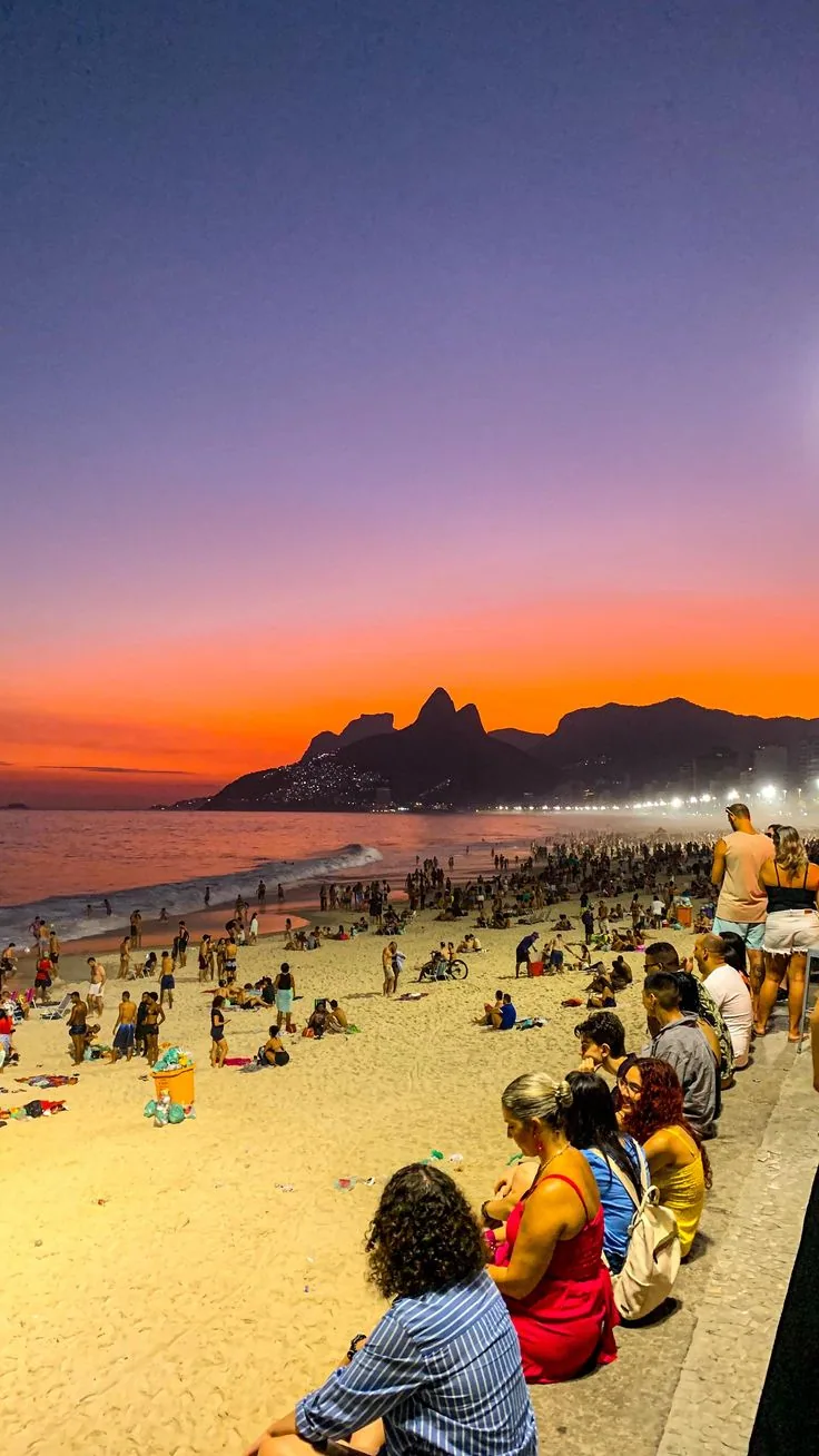 Golden hour transforms Ipanema's sky.